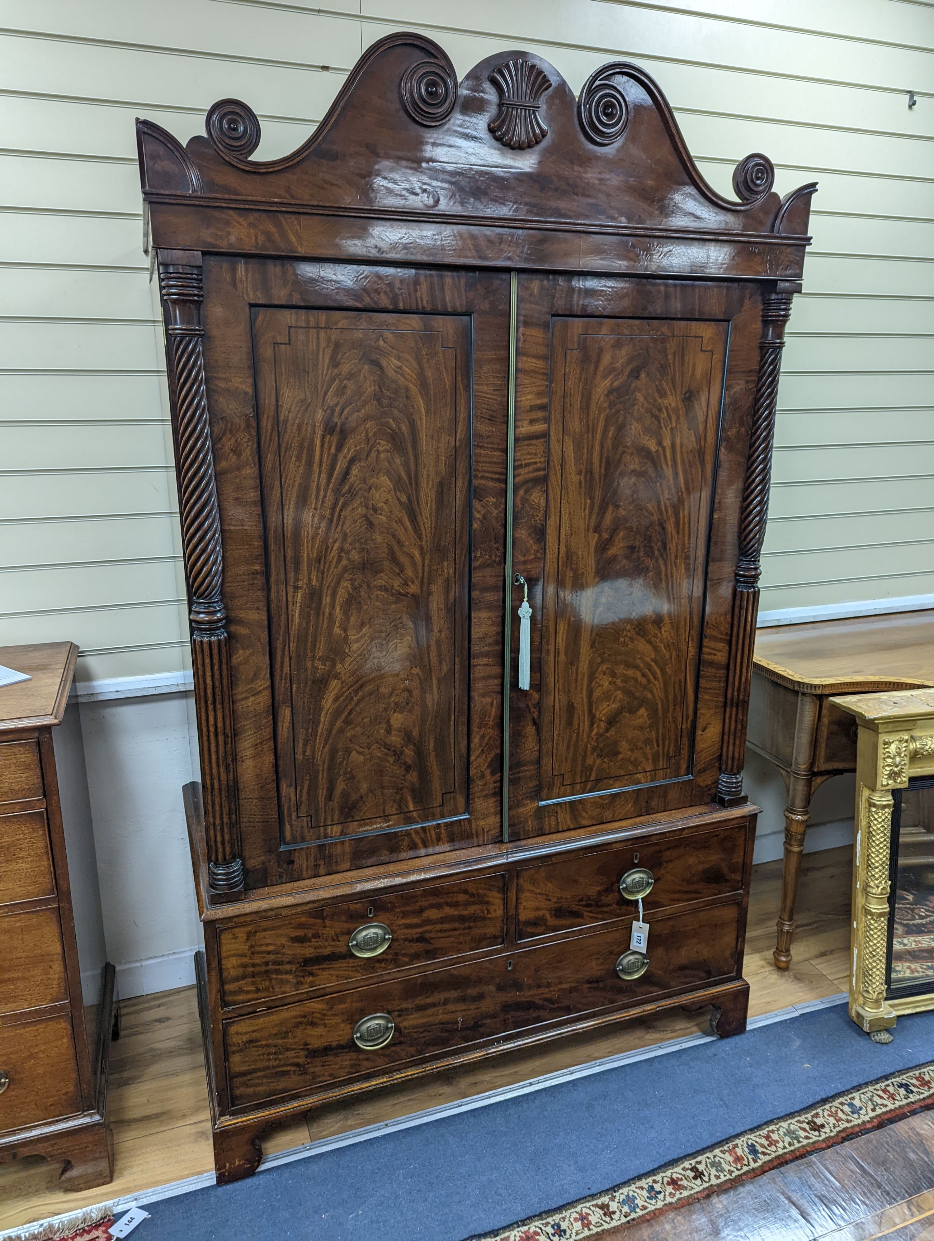 A William IV mahogany hanging cupboard, converted from a linen press, width 120cm, depth 57cm, height 204cm